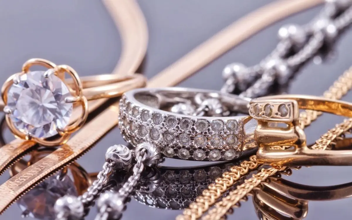 A close up of some gold and silver jewelry